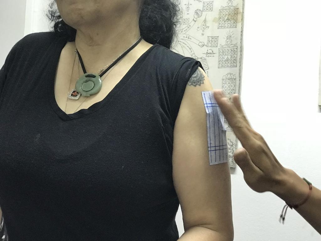 GypsyFay getting a sak yant tattoo from a Thai monk